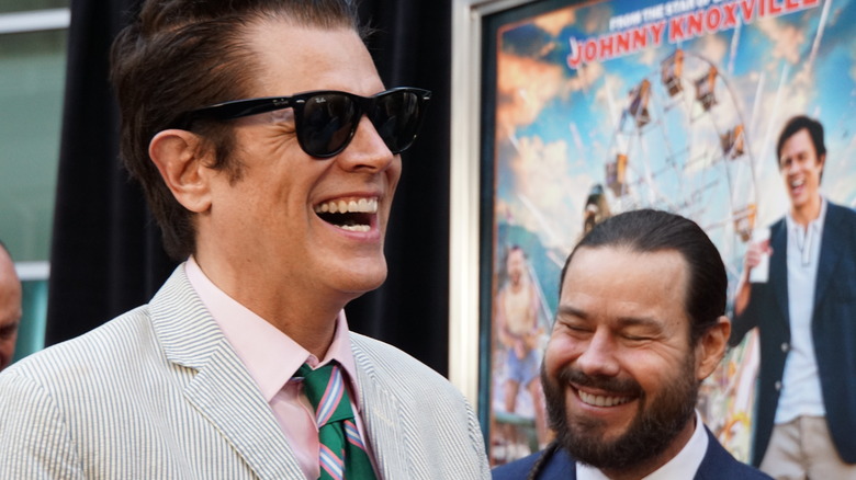 Johnny Knoxville and Chris Pontius laughing