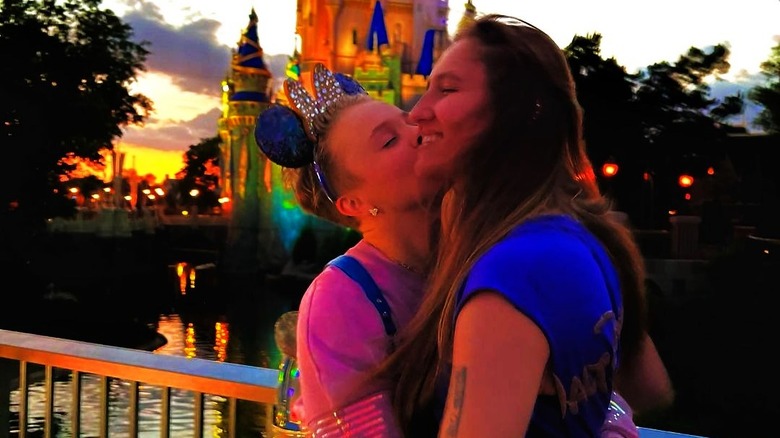 JoJo Siwa and Kylie Prew cozying up to each other at Disney World