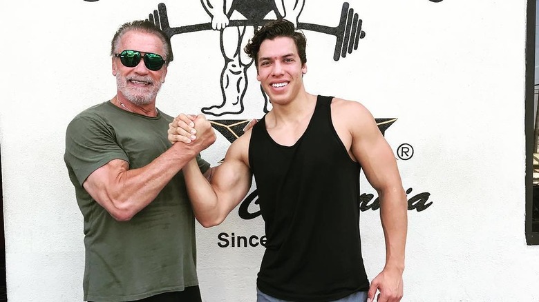 Joseph Baena and Arnold Schwarzenegger posing for a picture