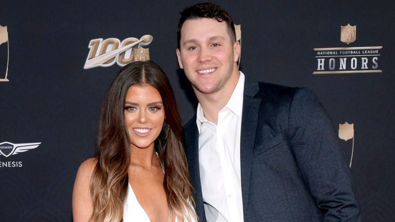 Brittany Williams and Josh Allen posing on the red carpet at the 9th Annual NFL Honors