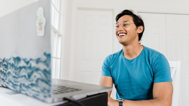 Josh Dela Cruz with laptop