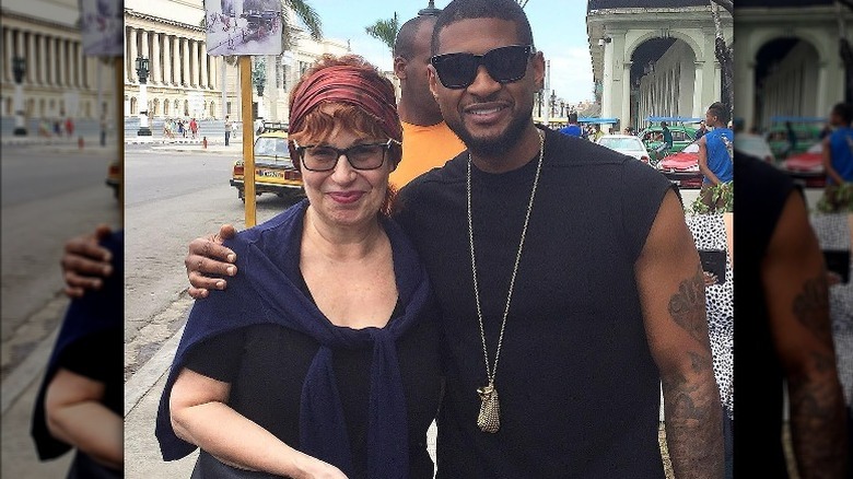 Joy Behar posing with Usher