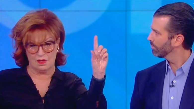 Joy Behar holding a finger up to Donald Trump Jr.