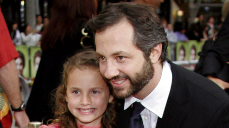 Maude and Judd Apatow posing on red carpet