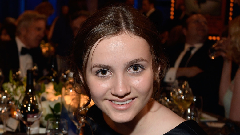 Maude Apatow smiling at black tie event