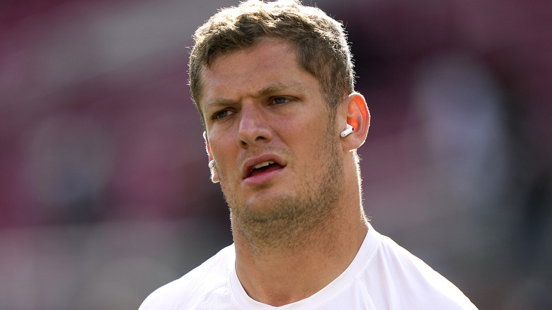 Carl Nassib on football field, mouth open