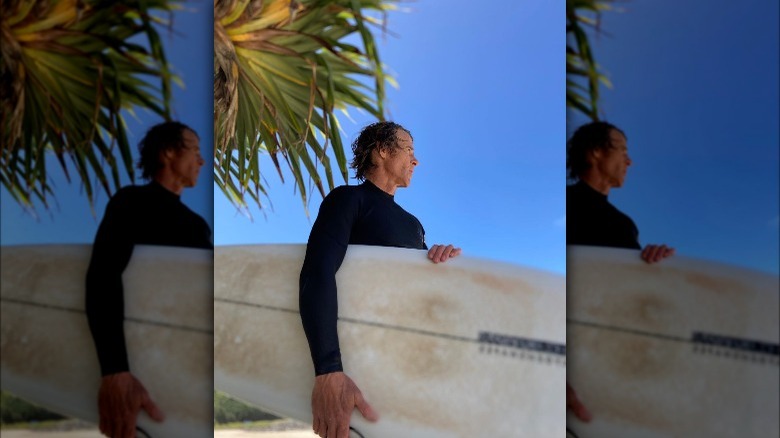 Danny Moder holding a surfboard