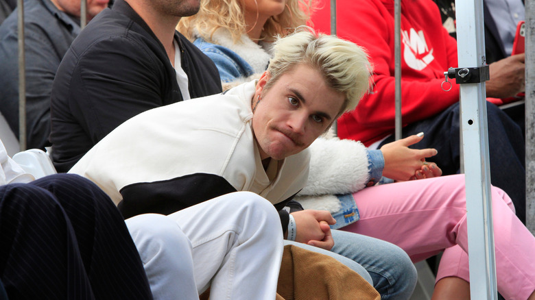 Justin Bieber looks grumpy