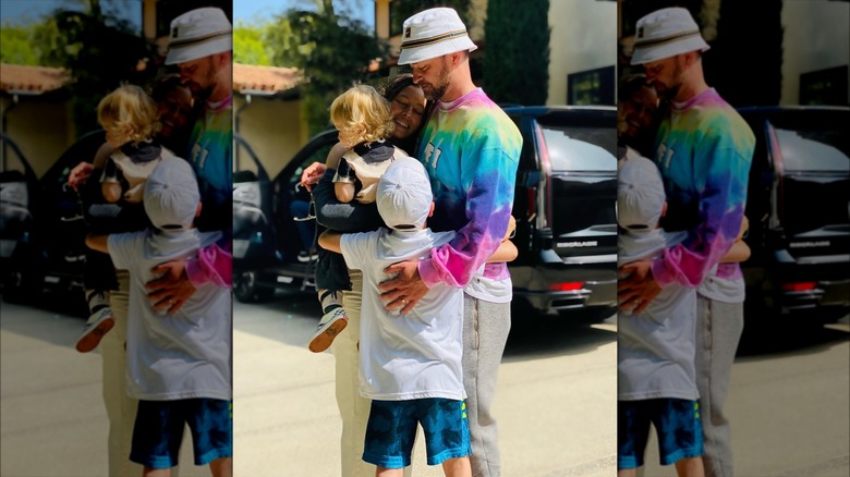 Jessica Biel, Justin Timberlake, Silas, and Phineas hugging