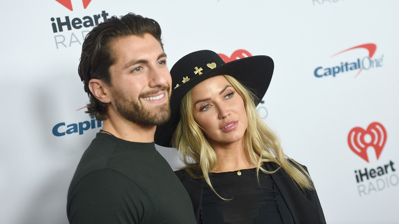 Jason Tartick and Kaitlyn Bristowe posing