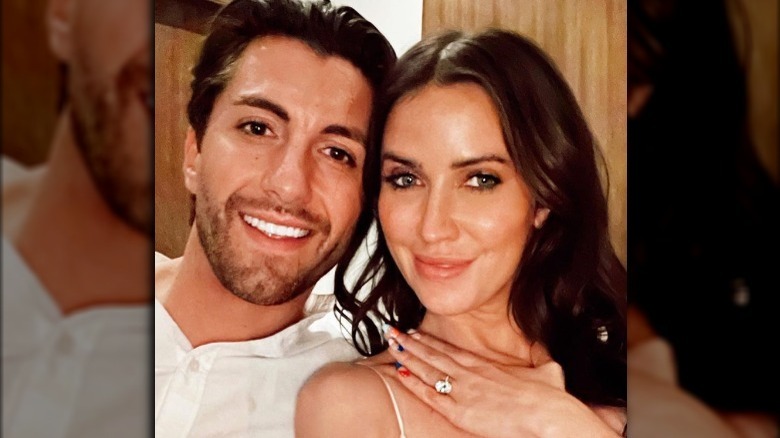 Jason Tartick and Kaitlyn Bristowe pose together with the engagement ring 