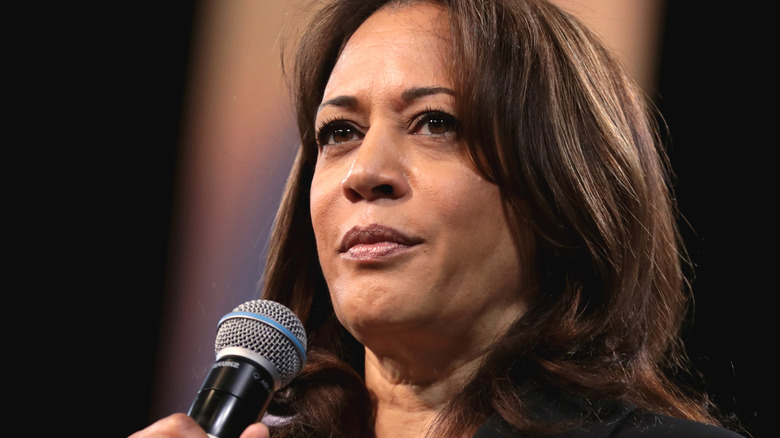 Kamala Harris with serious expression on stage