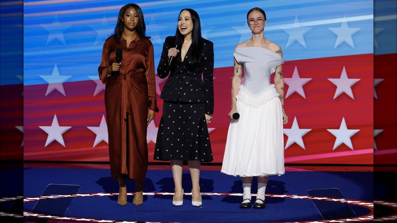 Helena Hudlin, Meena Harris, and Ella Emhoff speaking together on stage