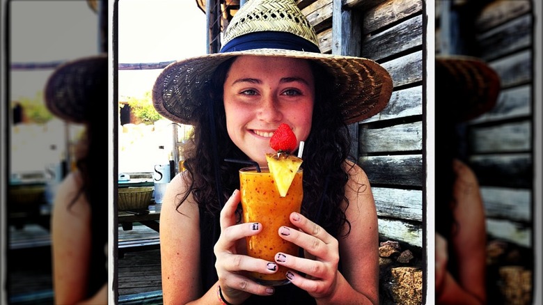 Ella Emhoff smiling and holding drink