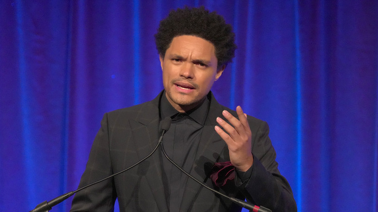 Trevor Noah speaking to an audience