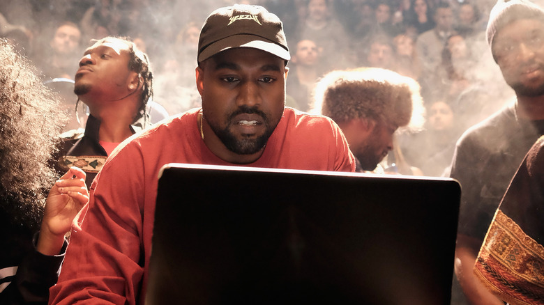 Kanye West in front of a computer screen