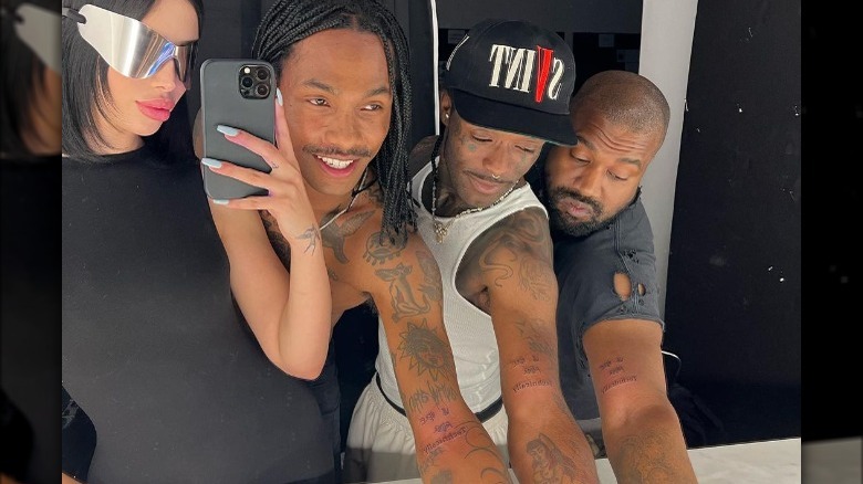 Kanye "Ye" West, Lil Uzi Vert, and Steve Lacy pictured showing off their matching tattoos