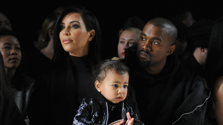 Kim Kardashian and Kanye West with their daughter