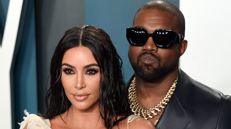 Kim Kardashian and Kanye West posing
