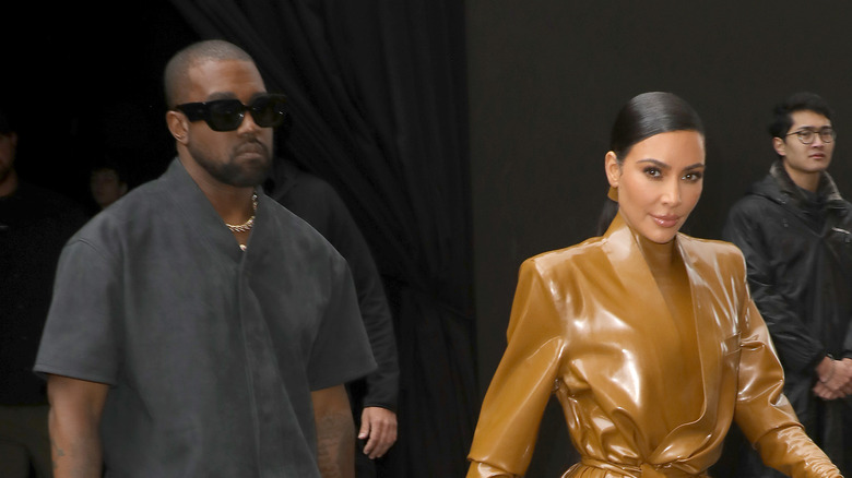 Kanye West and Kim Kardashian walking