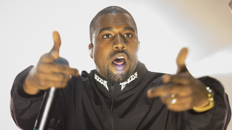 Kanye West giving double finger guns