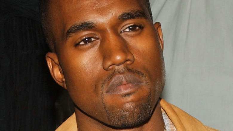 Kanye West tanned short clipped goatee