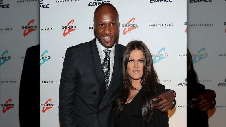 Lamar Odom with arm around Khloe Kardashian