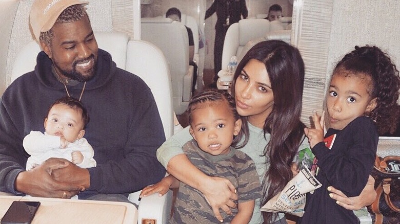 Kanye West, Kim Kardashian posing with their kids