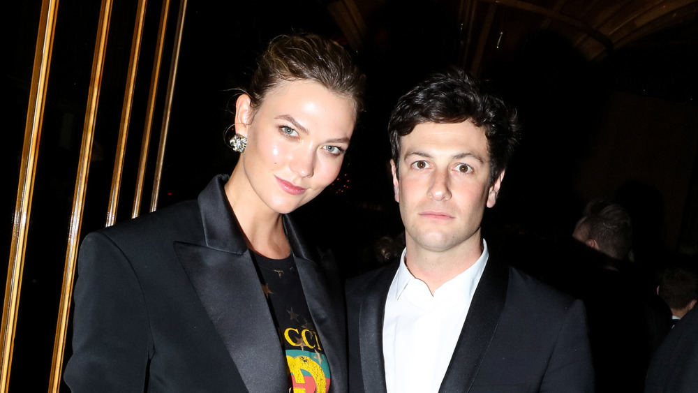 Karlie Kloss posing with husband Josh Kushner