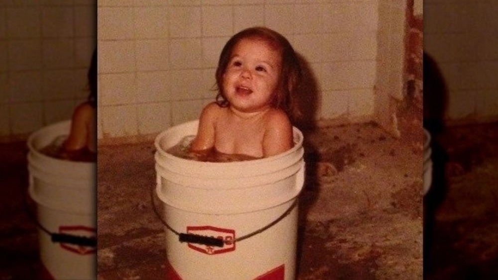 Baby Kat Von D in a bucket bath