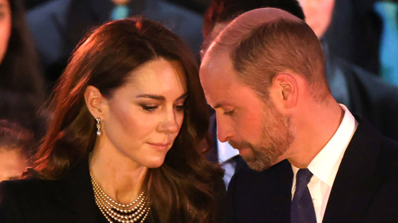 Kate Middleton and Prince William looking down