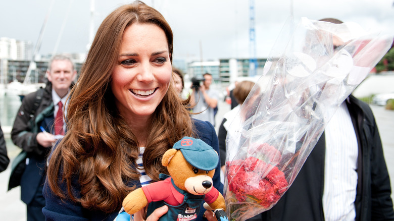 Kate Middleton holding bear, flowers