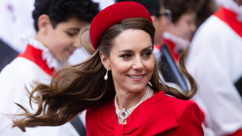 Kate Middleton smiling in her all-red ensemble