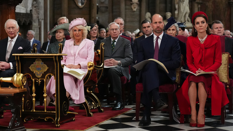 Kate Middleton sitting in her all-red ensemble