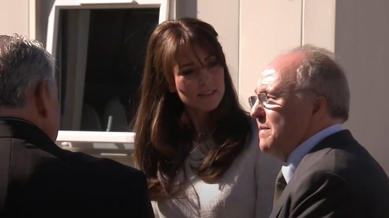 Kate Middleton with bangs and hair swept back