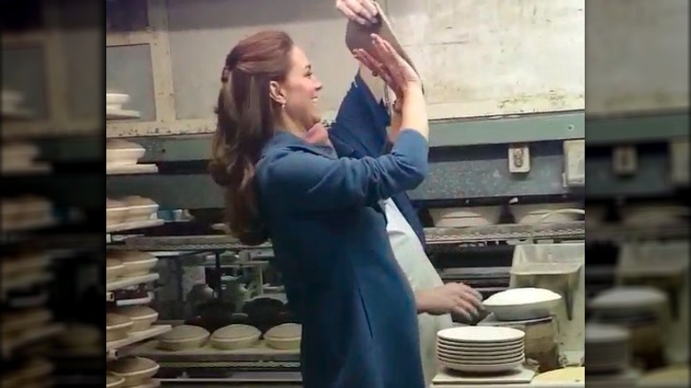 Kate Middleton tossing clay