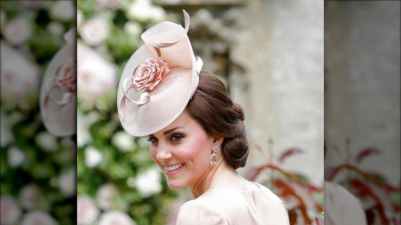 Kate Middleton with an elegant chignon and hat