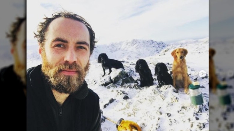 James Middleton and dogs on snowy mountain