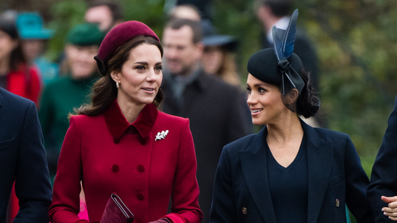 Kate Middleton talking to Meghan Markle