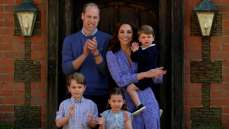 Prince William and Kate Middleton with their children at home 