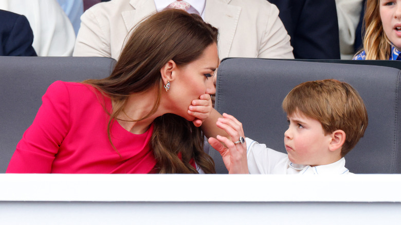 Prince Louis covering Kate Middleton's mouth