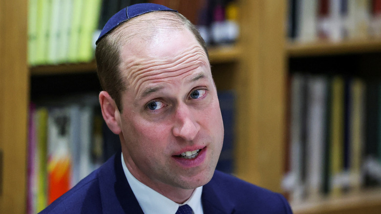 Prince William speaking while wearing a kippah