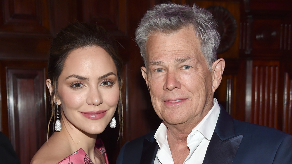 Katharine McPhee and David Foster posing together at an event