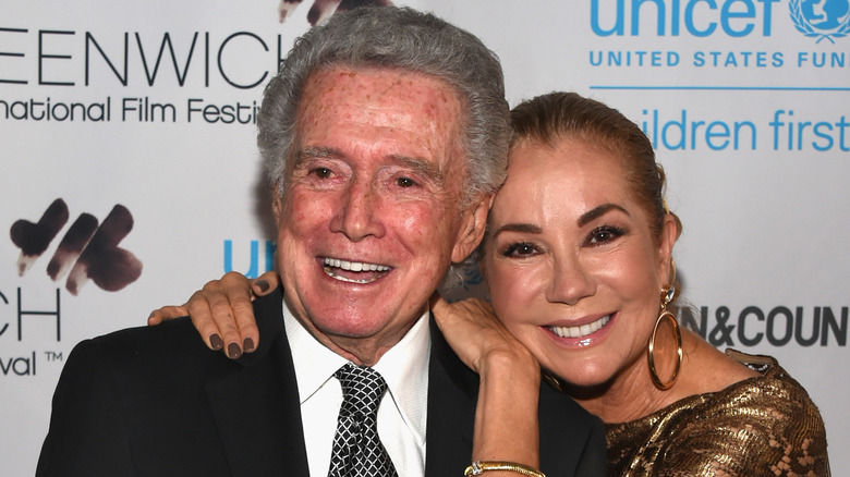 Kathie Lee Gifford hugging Regis Philbin