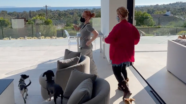 Kathy Griffin marching with friend and dogs