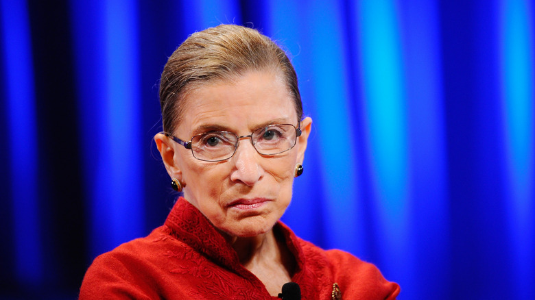 Ruth Bader Ginsburg wearing a red outfit.