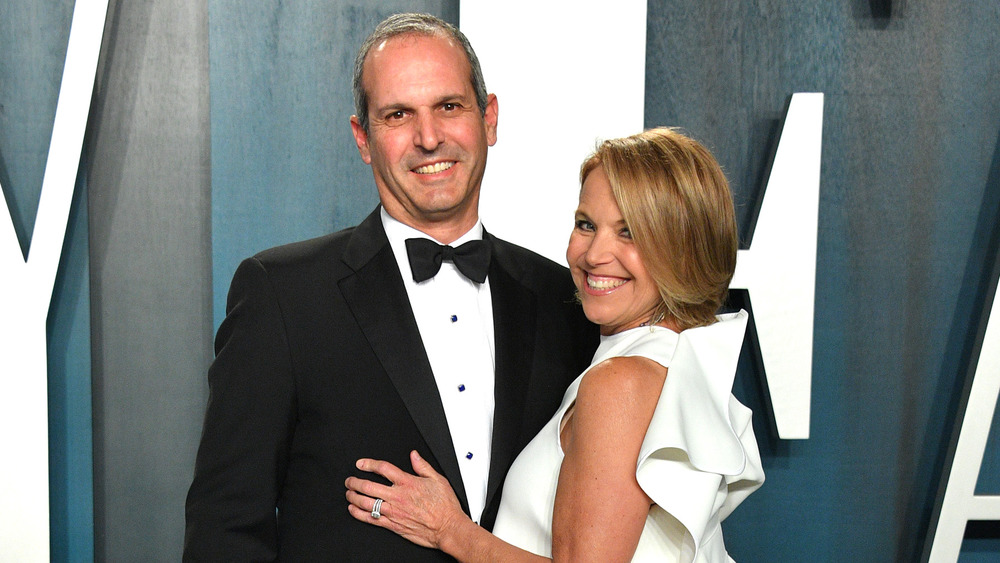 John Molner and Katie Couric pose on a red carpet