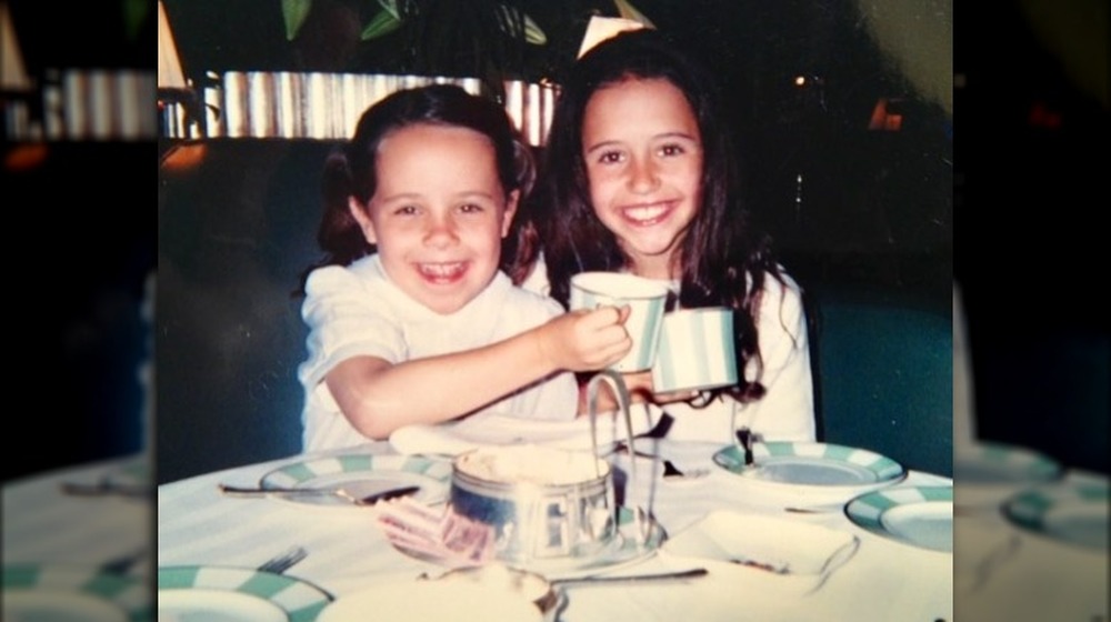 Carrie and Ellie Monahan have a tea party as kids