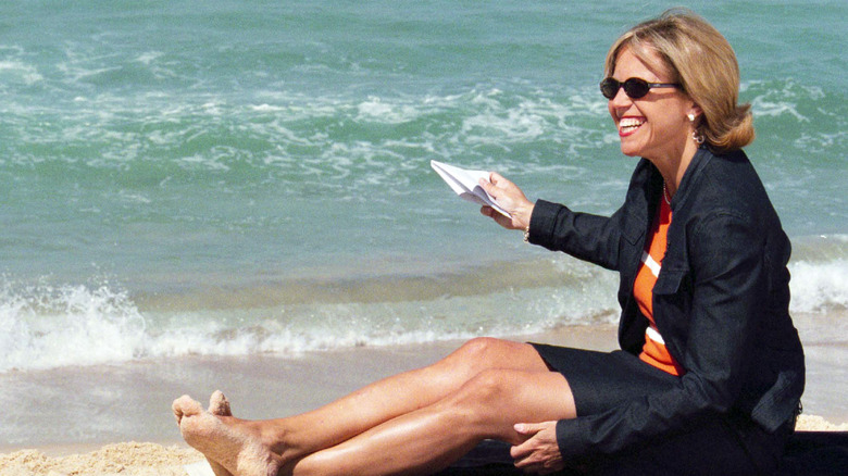 Katie Couric posing on the beach