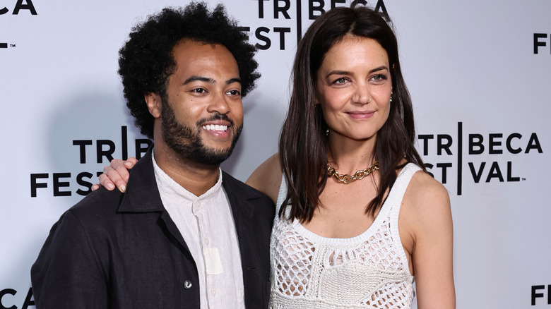 Katie Holmes with arm around Bobby Wooten III